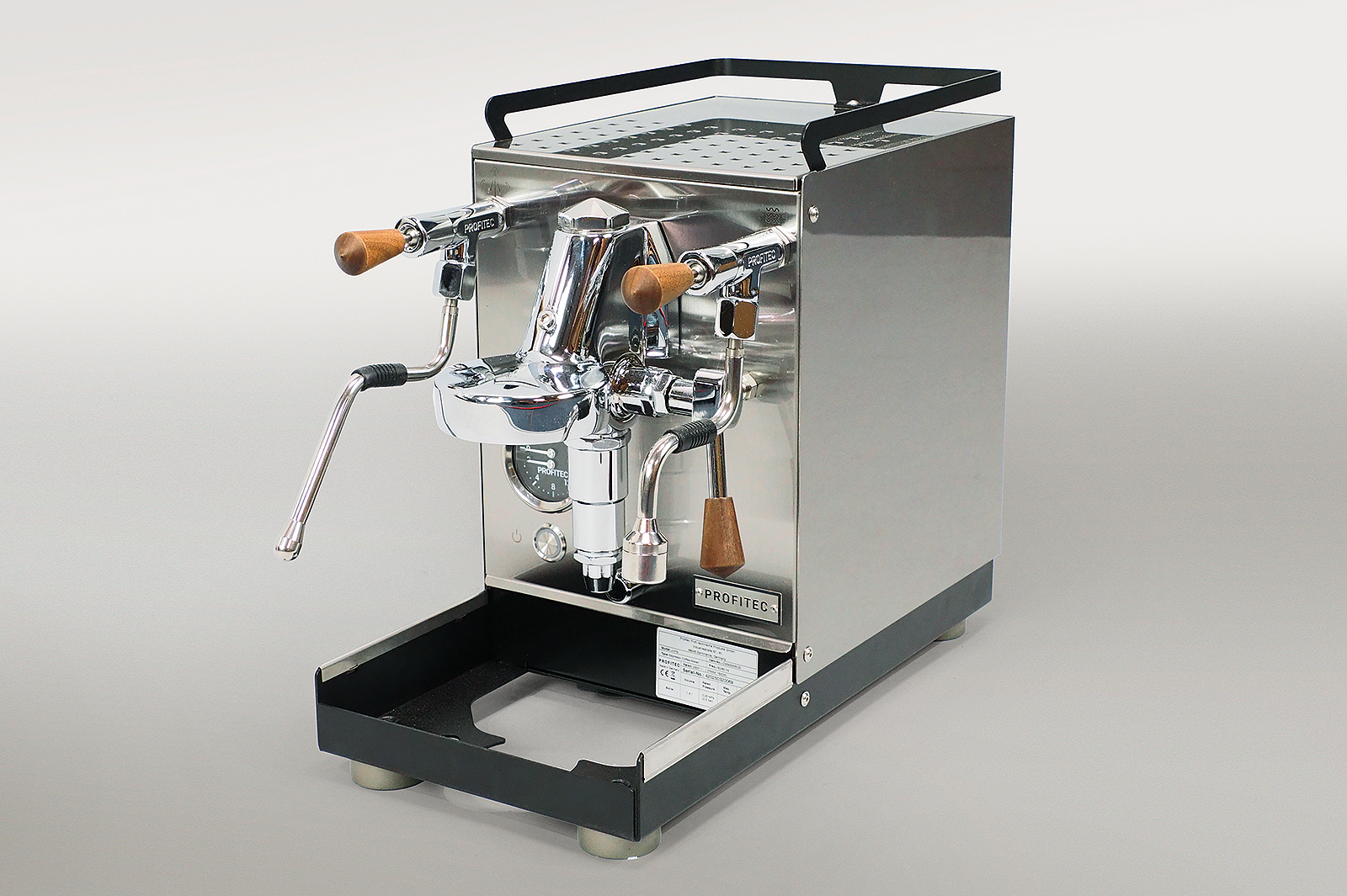 Nachhaltige Verpackung einer Siebträgermaschine mit Rekkor®-Wabenpolster, faltbaren 3D-Polstern und passgenauer Zubehörverpackung